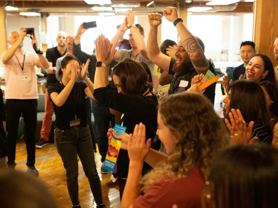 corporate team building in toronto employees clapping